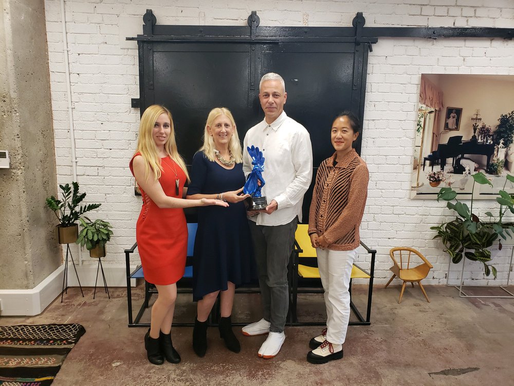 Seth Wilson and Tash Tan with Barbara Levy and Laurissa Levy as they present Somesuch with the Regional Production Company Of The Year statue